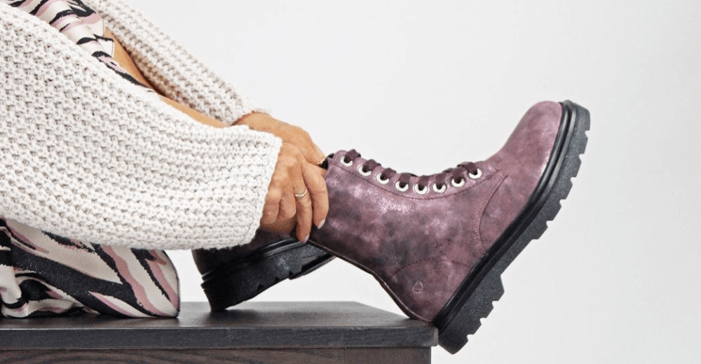 Heavenly Feet how to save money banner. Image a close up of a woman putting on a purple boot