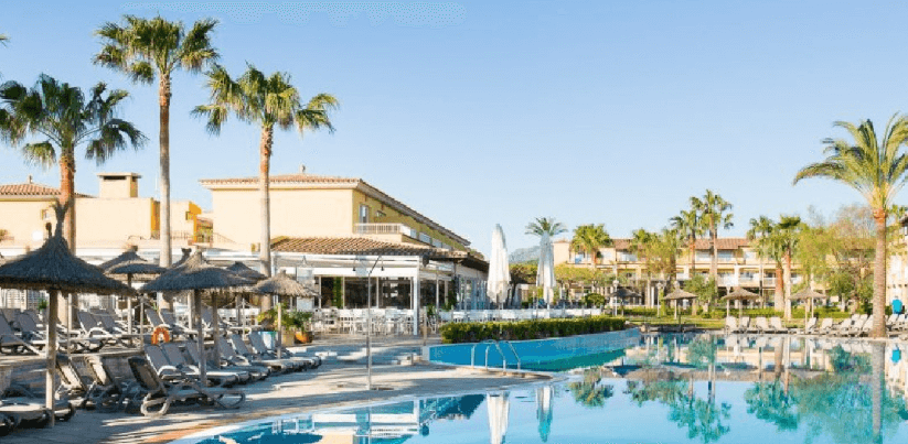 Holiday Gems deals page image showing a poolside view of an exotic holiday destination