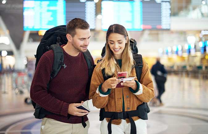 Guy and girl looking a phone
