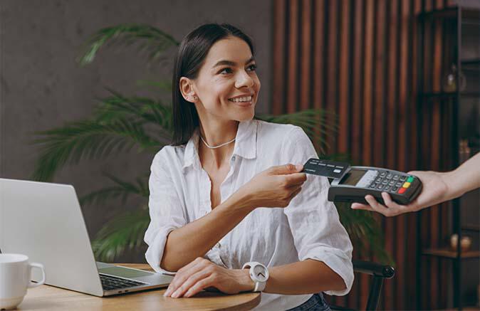 Women paying with her credit card