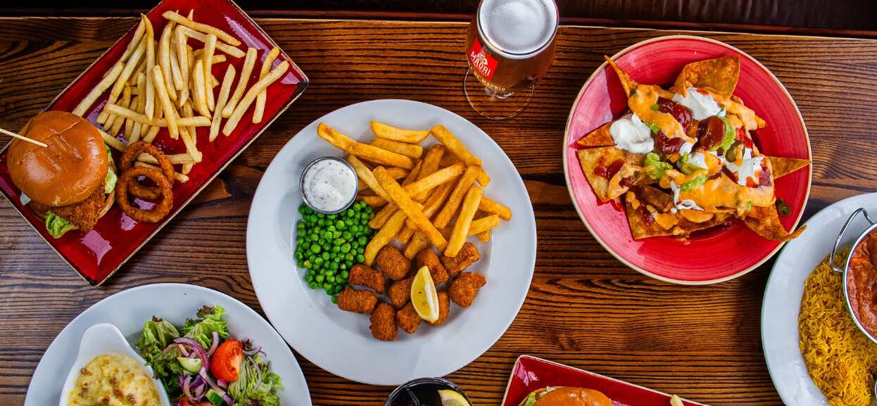 Hungry Horse offers page image showing an overhead view of a selection of dishes, including burger and chips