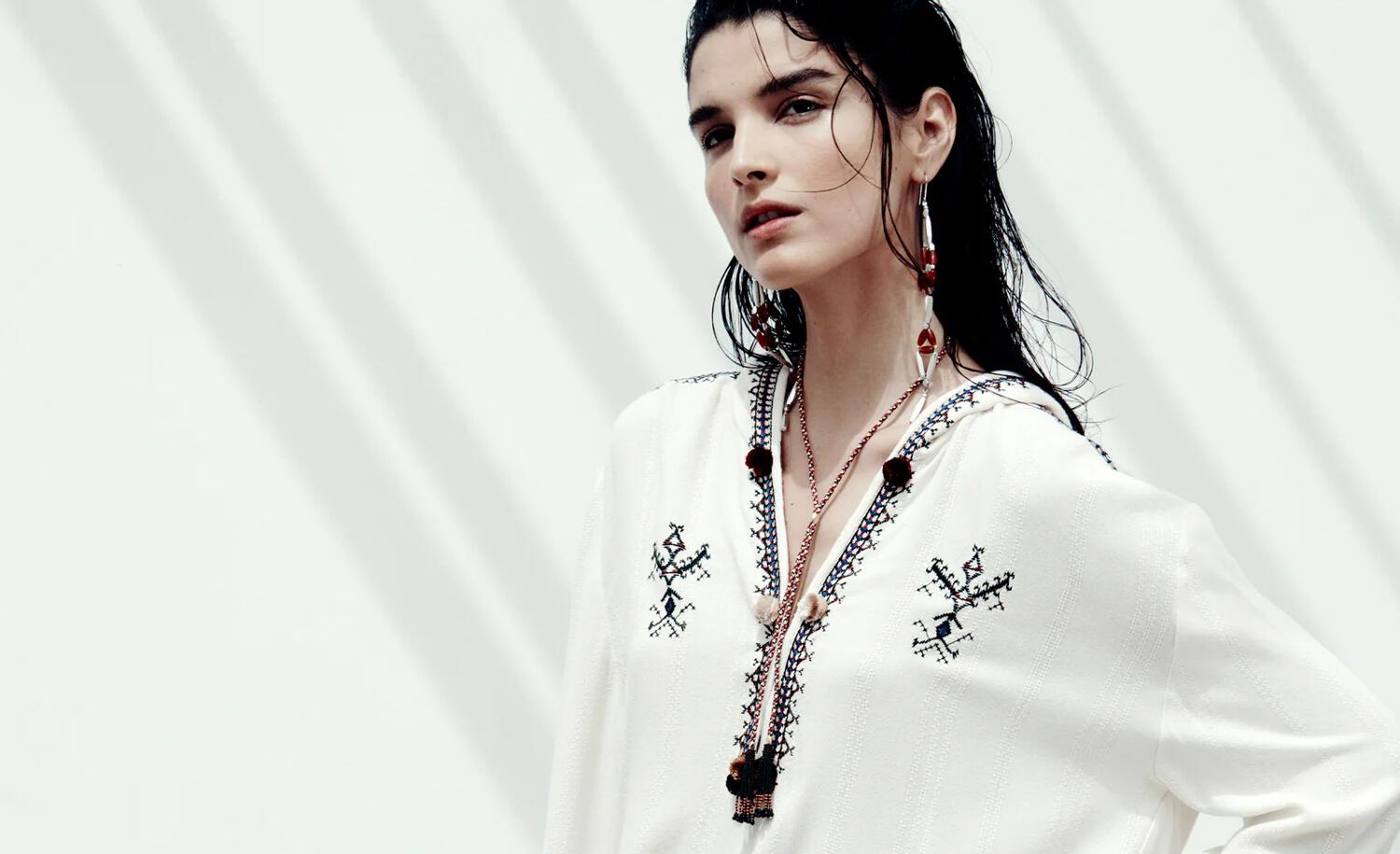 Woman wearing white Isabel Marant top from spring-summer collection