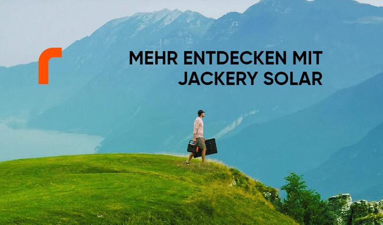Banner für die Jackery Gutscheinseite: Mann läuft durch eine bergige grüne Landschaft mit einer Jackery Powerbank und einem faltbaren Solarpanel in den Händen