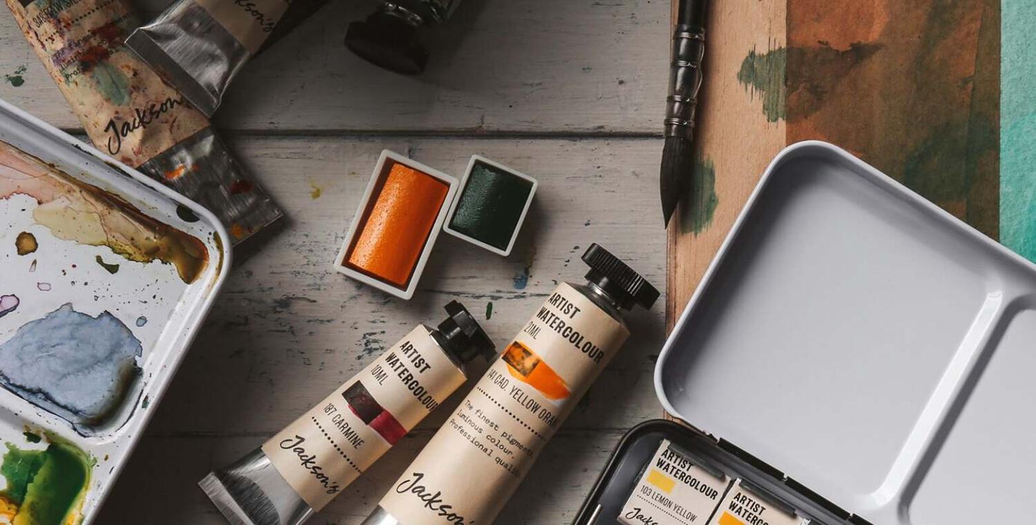 Jackson&apos;s Art savings tips banner featuring a collection of artist products, including paint tubes, a paintbrush and a palett