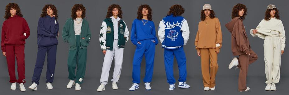 Model in verschiedenen Jaded London Jogginganzügen vor grauem Hintergrund
