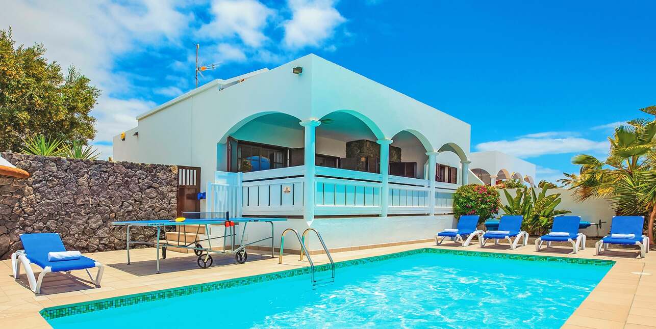 Jet2holidays deals image showing a resort pool with sun loungers