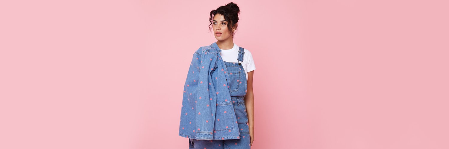 Joanie Clothing discount codes banner - women&apos;s fashion, woman wearing denim dungarees