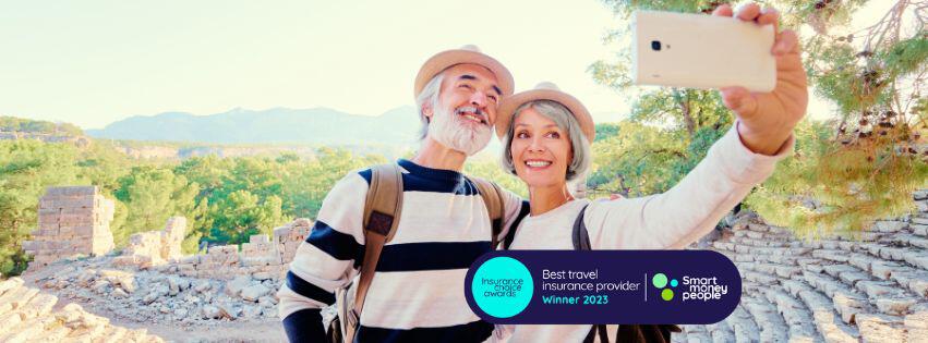Couple taking a selfie on holiday. Badge showcasing Just Travel Cover&apos;s winning award for Best travel insurance provider from the Insurance Choice Awards