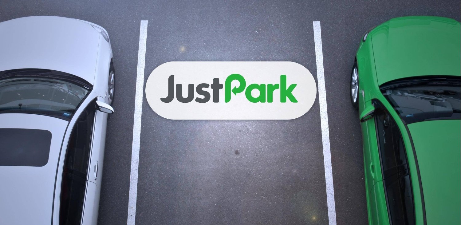 Car parked in a Just Park parking space. Image contains the Just Park logo.