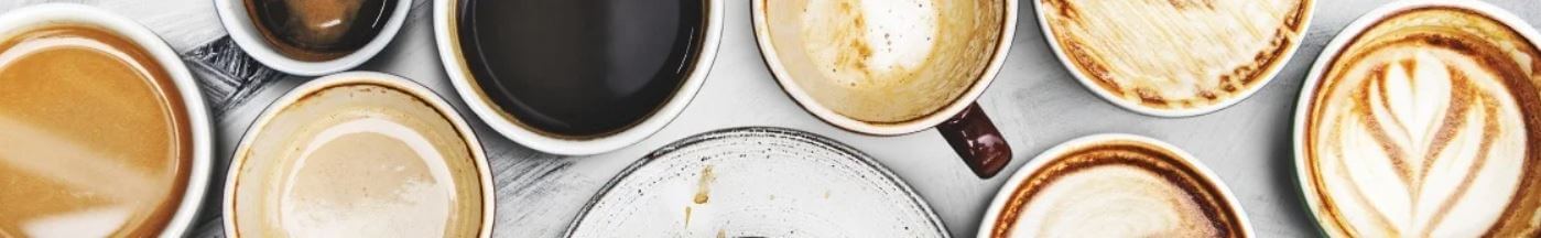 Banner für die Gutscheinseite zum Kaffeevorteil-Online-Shop mit Abbildung verschiedener Tassen Kaffee