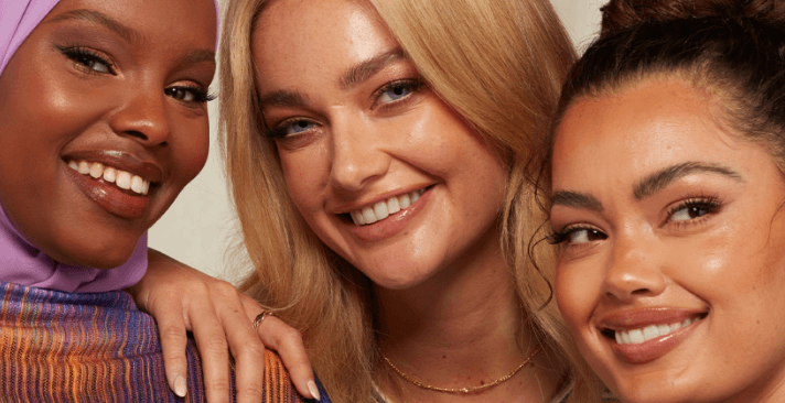 lookfantastic autumn/winter cosmetics banner. Image shows 3 women smiling up close