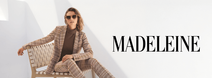 Woman wearing two piece suit trousers and blazer from MADELEINE