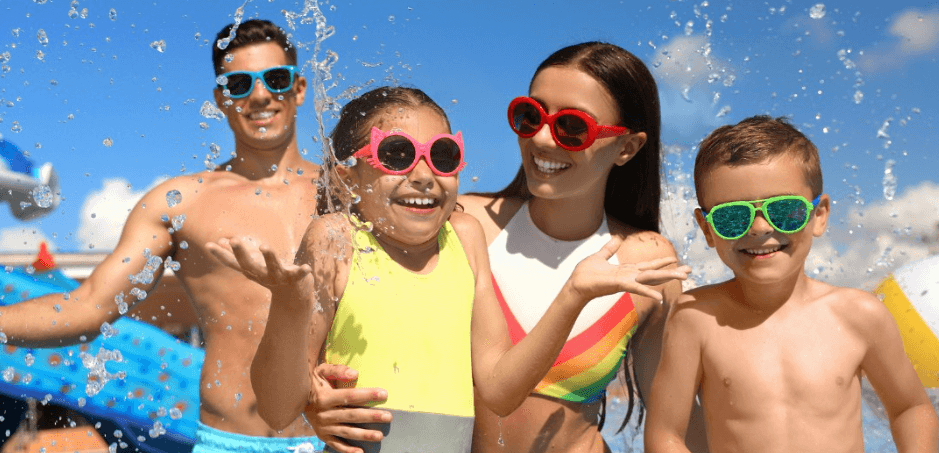 MagicBreaks how to save money banner showing a young family wearing brightly coloured sunglasses at a water park