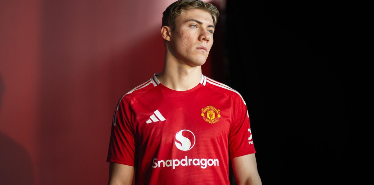 Manchester United Store new season kit image showing shirt on grass