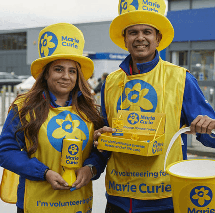 man and woman fundraising for Marie Curie