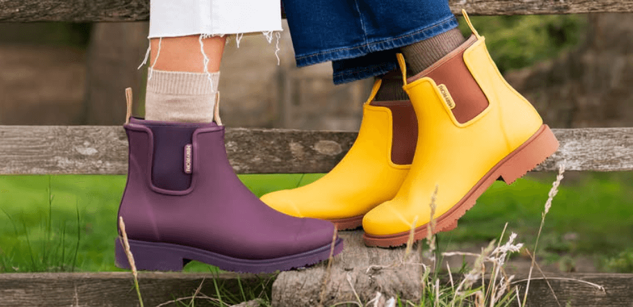 Merry People deals page image - 2 sets of feet wearing yellow and purple coloured boots