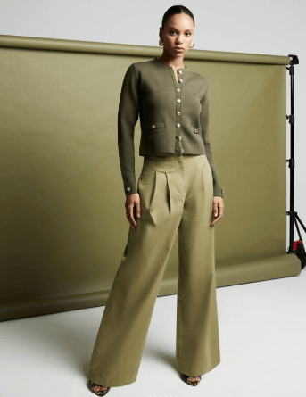 model-standing-wearing-green
