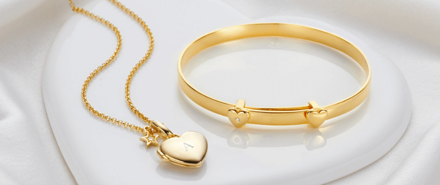 Molly Brown how to get a better discount banner showing a gold bracelet and necklace on a white pillow