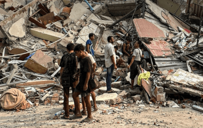 Children next to Myanmar earthquake damage