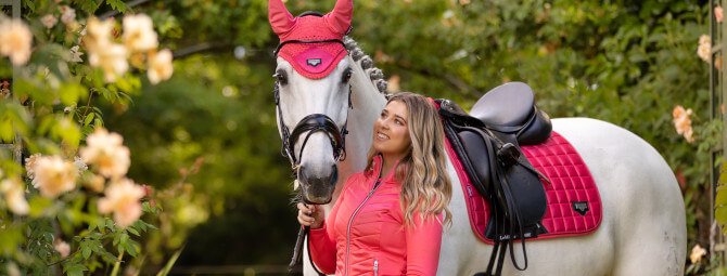 Woman with a horse wearing Naylors horse equipment