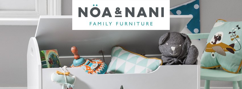 White wooden toy chest containing a teddy bear and other children&apos;s bedroom accessories from Noa and Nani. Text reads: Noa and Nani. Family Furniture.