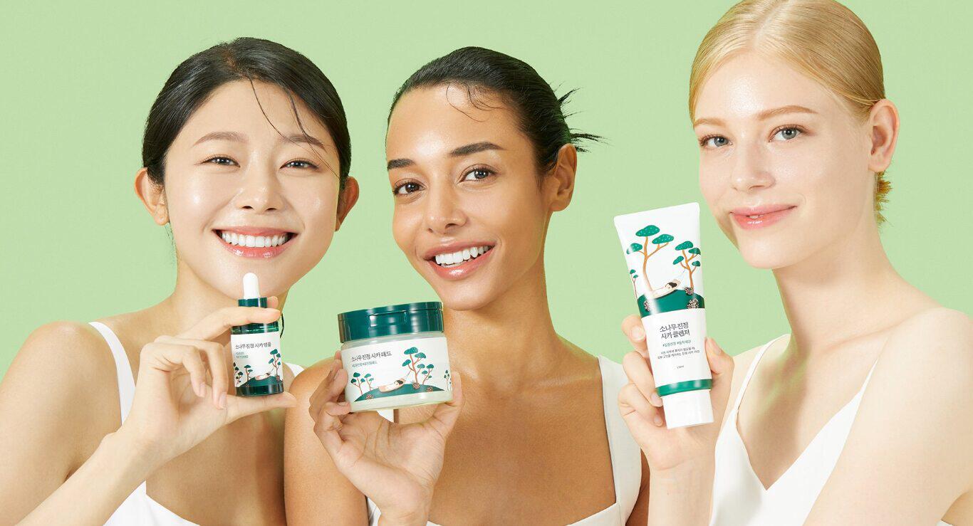 Olive Young how to save banner - 3 smiling women holding up beauty products