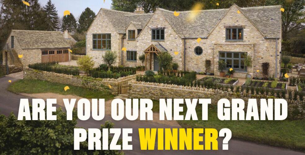 Omaze how to save money guide image - Large house with the the text &apos;are you our next grand prize winner&apos; overlaid