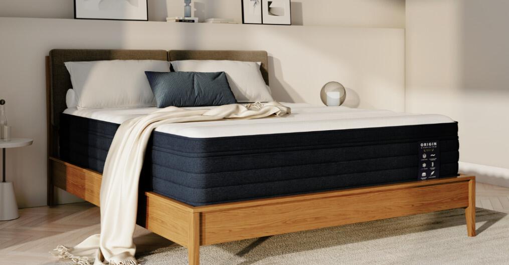 Origin Mattress offers page image - A bed with bare branded mattress