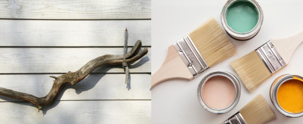 Outdoors beauty image showing a piece of driftwood hanging on a wall, alongside open paint cans with brushes
