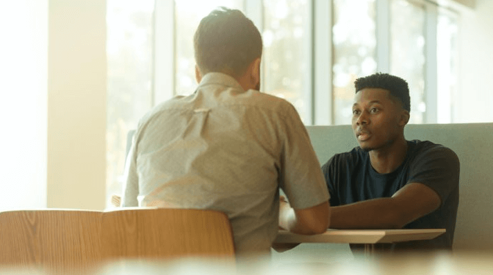 Oxfordshire Mind support course image showing two men talking