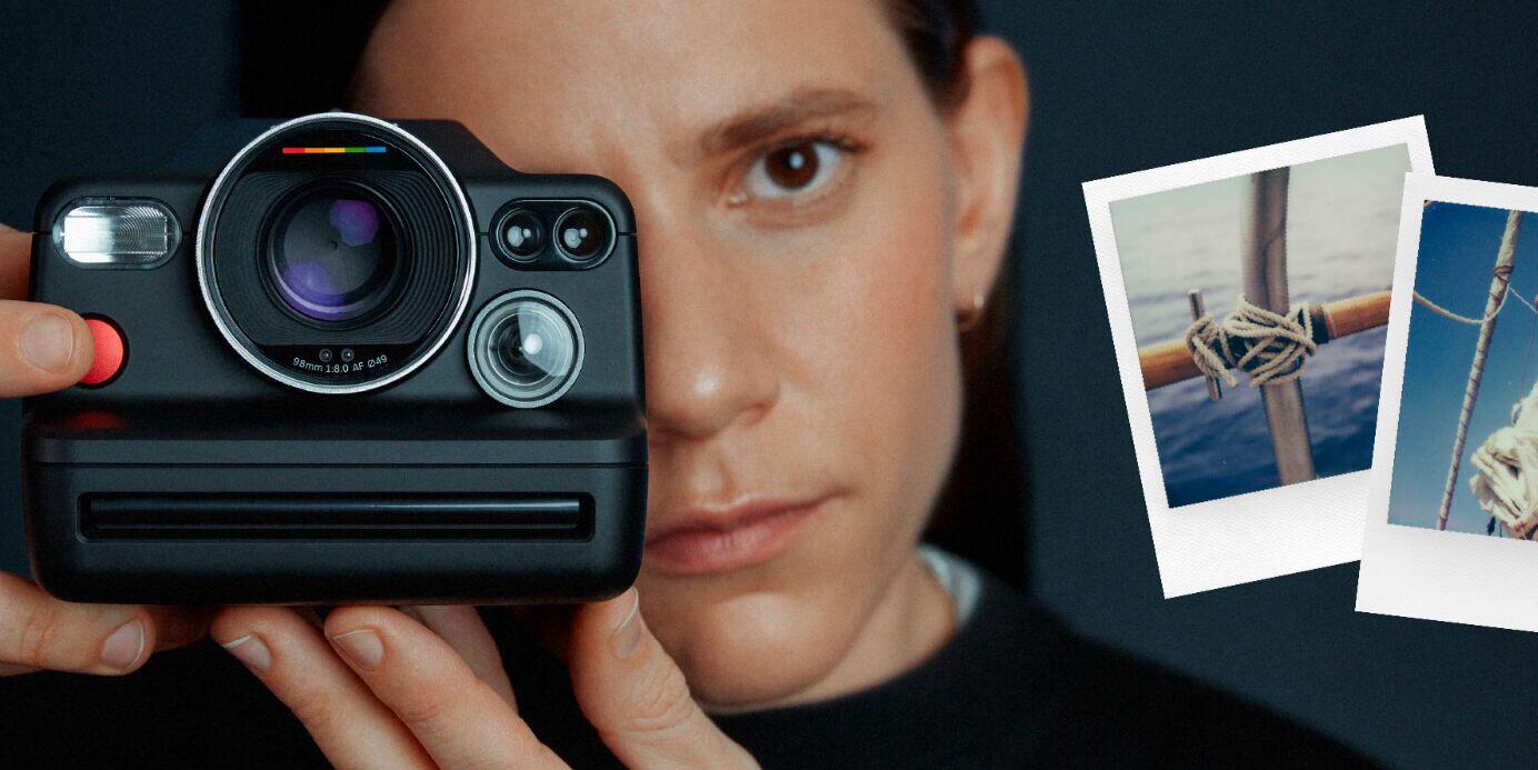 Polaroid page image featuring a woman taking a picture with a black Polaroid camera