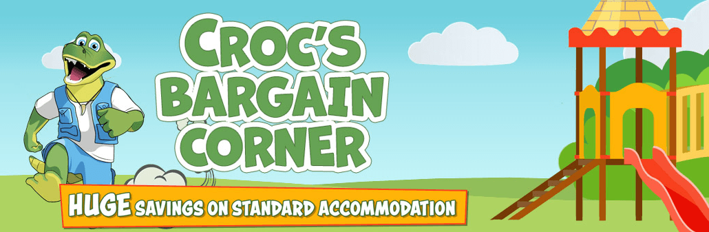 Pontins discount banner - Croc&apos;s Bargain Corner cartoon of a jolly crocodile in a playground