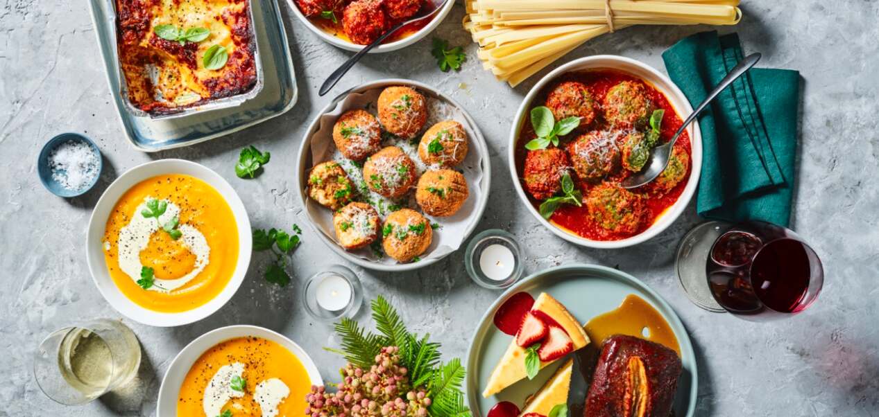 Providoor deals page image - A selection of prepared dishes alonside ingredients on a grey table top