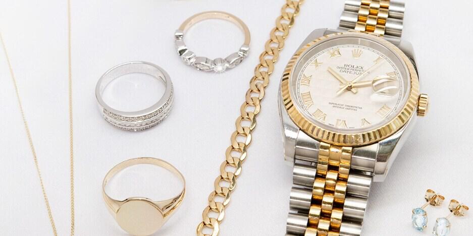 Ramsdens offers page image showing a collection of gold and silver jewellery, including a watch and rings