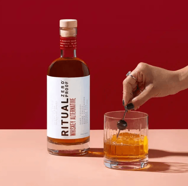 Ritual Zero Proof Whiskey Alternative bottle and whiskey glass