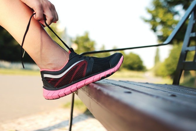 Person doing up running trainers