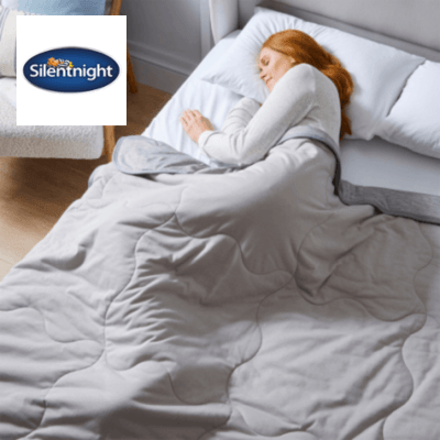a woman asleep on her side in a Silentnight bed