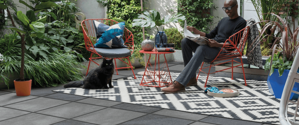 Simply Paving - Man and cat sitting on paving
