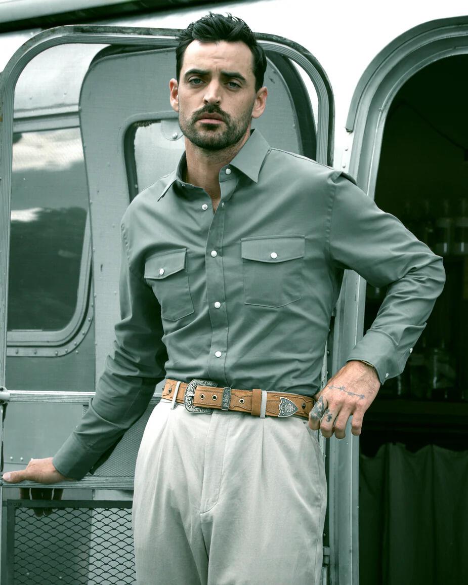 Man wearing Snaps Clothing green button-up shirt
