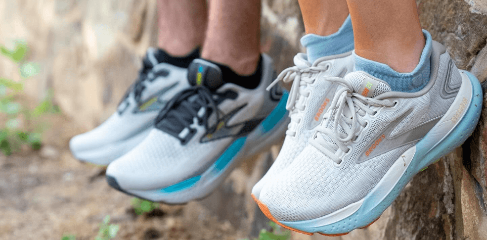 Sportitude savings guide - Close up image of 2 lower legs wearing trainers against a wall background