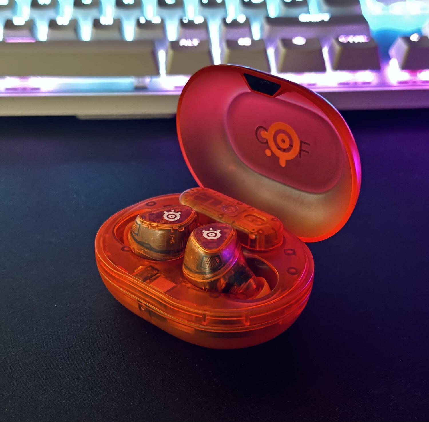 Steelseries neon orange earbuds in case