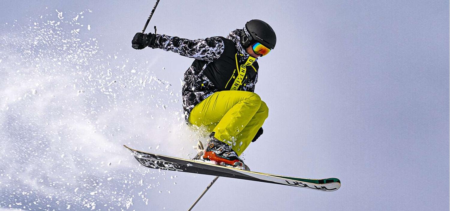 Surfanic offers page banner - Image features a person wearing ski gear performing a jump