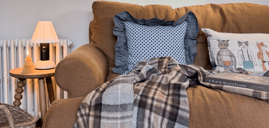 TBCo ways to save banner showing a sofa with a throw and pillows on it