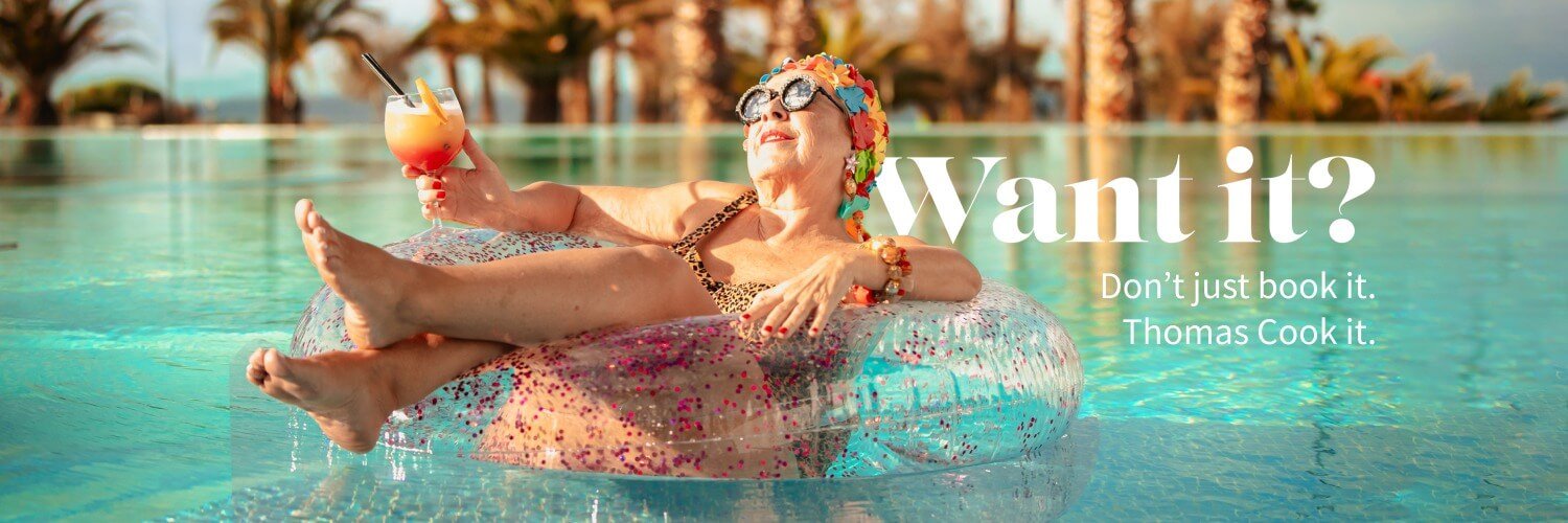 Woman enjoying a pool resort holiday through Thomas Cook