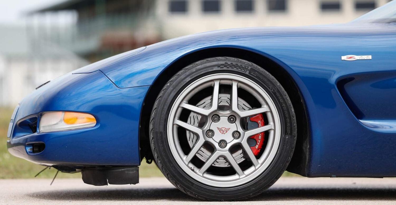 Tire Streets offer banner featuring a close up shot of a wheel on a blue car
