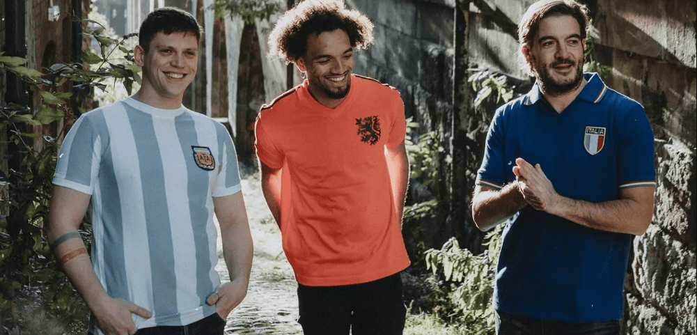 Toffs savings page banner - Image features 3 men in football shirts standing in a street