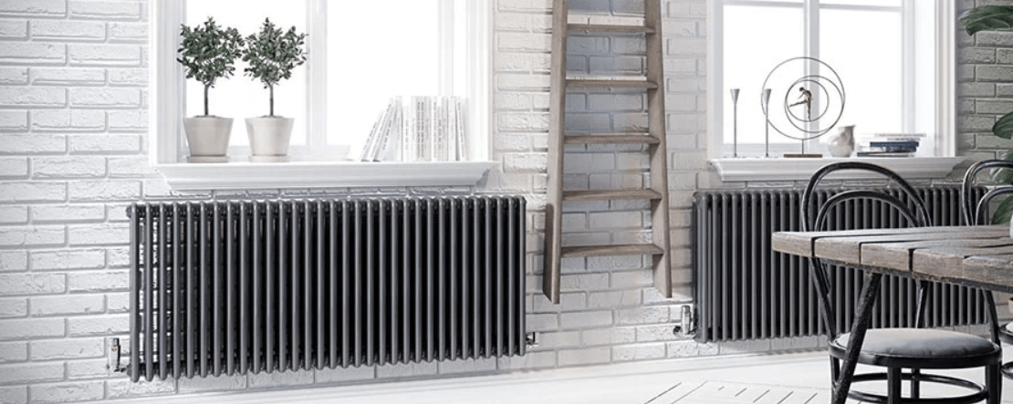 Trade Radiators offers page banner. Image shows grey room with 2 prominent radiators