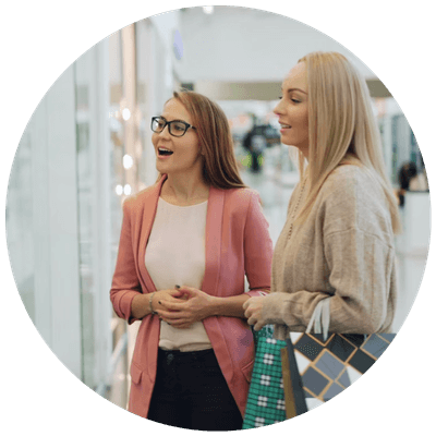 Two women fashion shopping in a shopping mall