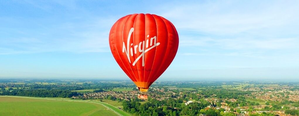 Virgin Balloon Flights how to save money guide - Branded hot air balloon in the sky