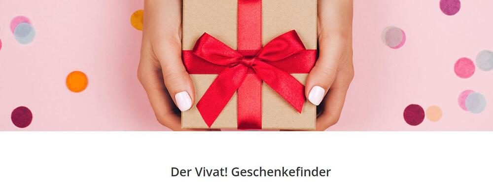 Ein von Händen gehaltenes Geschenk mit Konfetti auf pinkem Grund mit Hinweis auf den Vivat Geschenkefinder